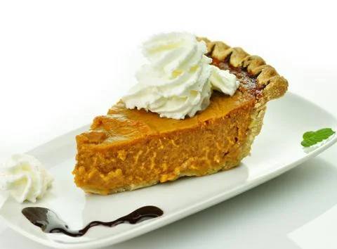 Slice of pumpkin pie Stock Photos