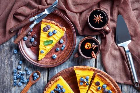 Slice of pumpkin pie on a plate Stock Photos