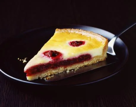 Slice of raspberry and custard tart 写真素材
