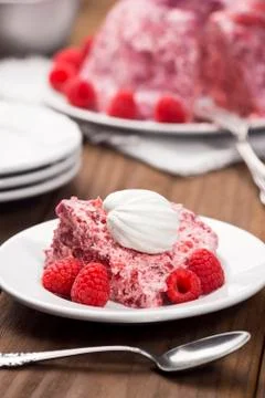 Slice of Raspberry Charlotte with Whipped Cream Stock Photos