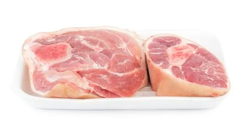 Slice of raw pork knuckle in a plastic container isolated Stock Photos