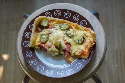 Slice of rectangular shaped home made pizza on plate Stock Photos