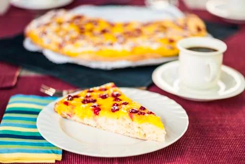 Slice of red currant and quark cake with a cup of coffee Stock Photos