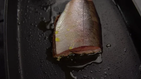 Slice of red fish fried in deep pan. Stock Footage 111074147
