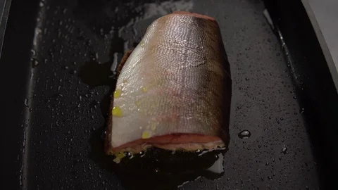 Slice of red fish fried in deep pan. Stock Footage 112400790