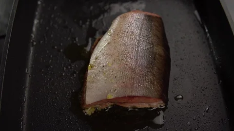 Slice of red fish fried in deep pan. Stock Footage 112401079