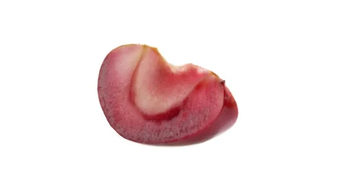 Slice of red-fleshed apple rotating. Isolated. White background. Stock-Footage 169750258