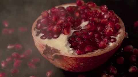 A slice of red garnet on a dark background Stock Footage 147096074