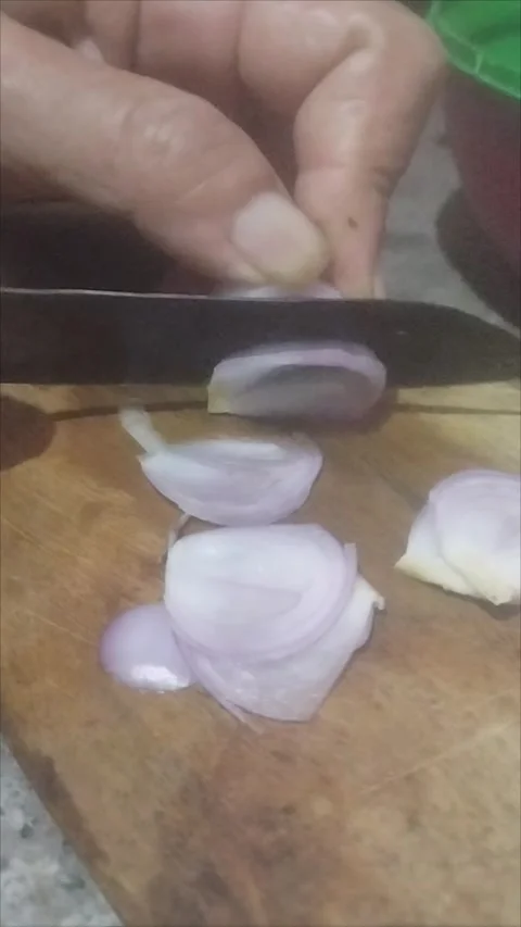 Slice the red onion with a sharp knife Stock Footage 290984804