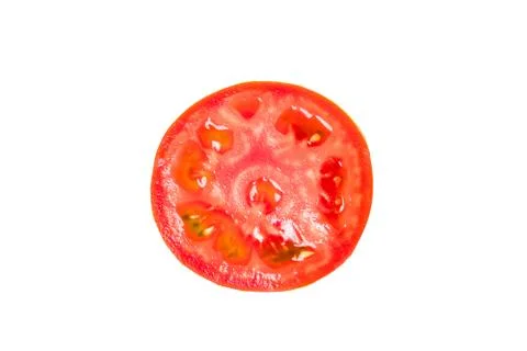 Slice of red tomato isolated on a white background. Stock Photos