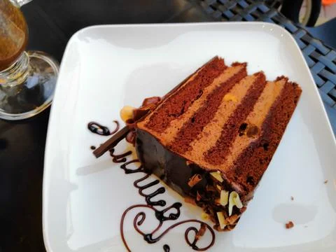 A slice of rich moist devil's food chocolate cake - photographed Stock Photos