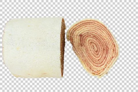 Slice of roll cake next to the cake (roll cake). Brazilian traditional sweet. Stock Photos