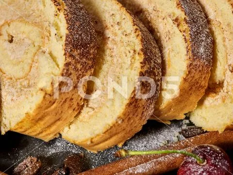 Slice rolled biscuit cake with cream for breakfast dessert Stock Photos