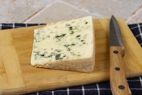 Slice of roquefort cheese close-up Stock Photos