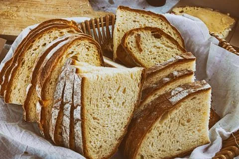 Slice of rustic bread set basket delicious fresh background Foto stock