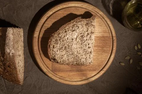 Slice of rustic natural yeast-free bread with flax, poppy seeds, sesame seeds Stock Photos
