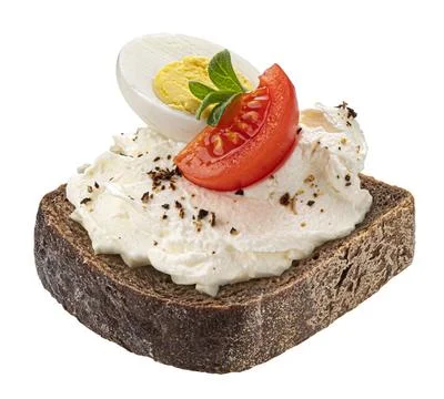 Slice of rye bread with cream cheese, tomato and egg isolated on white bac... Stock Photos