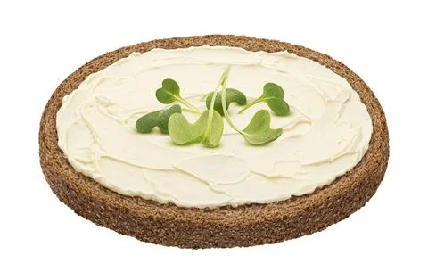 Slice of rye bread with smeared butter isolated on white background Stock-Fotos