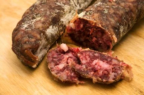 Slice of salami Stock Photos