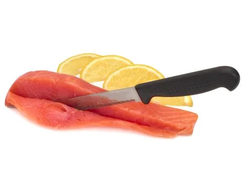 Slice of salted salmon on white background with knife and lemon Stock Photos