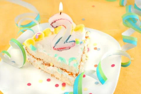 Slice second birthday cake Stock Photos