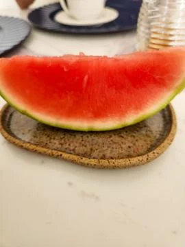A slice of seedless watermelon for breakfast. Stock Photos