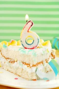 Slice of sixth birthday cake Stock Photos