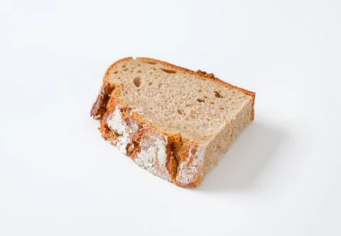 Slice of sourdough bread with crispy crust Foto stock