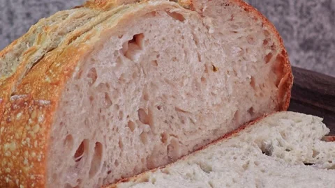 A slice of sourdough bread. Pan to left. Stock Footage 307845572