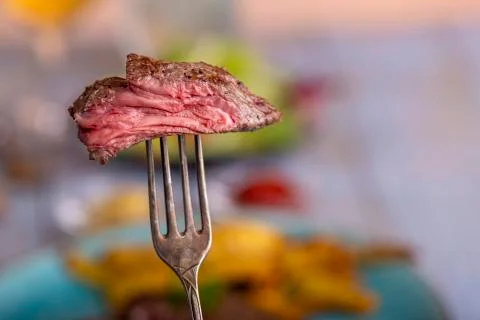 Slice of steak on a fork Stock Photos