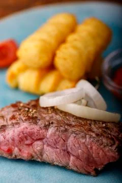 Slice of steak Stock Photos