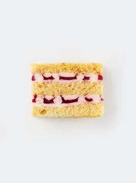 Slice of strawberry cake. Top view. Slice filling in section on a white backg Stock Photos