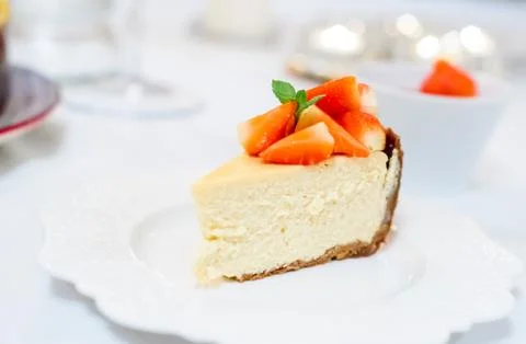 Slice of strawberry cheesecake selective focus Stock Photos