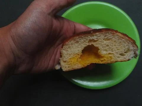 A slice of sweet bread with sweet jam filling Photos