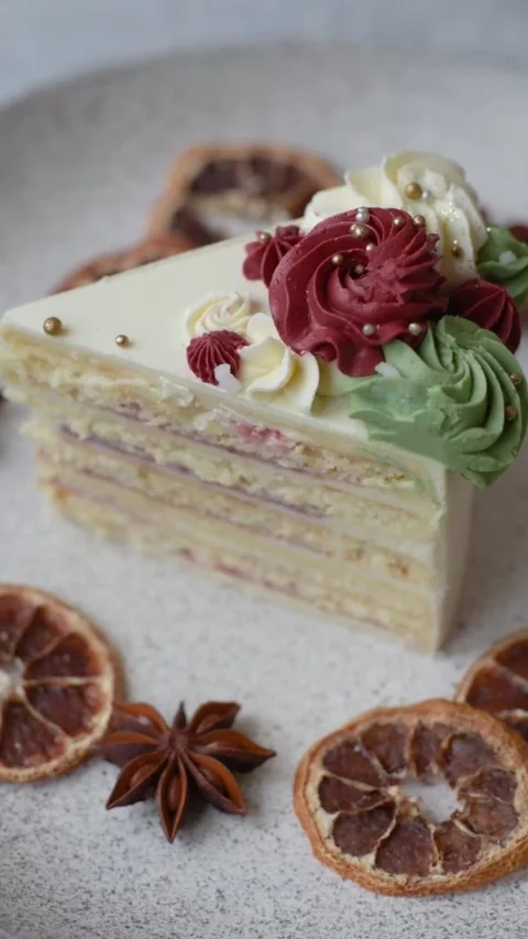 A slice of sweet layered cake with white cream for a birthday or holiday. A slic Stock Footage 324674943