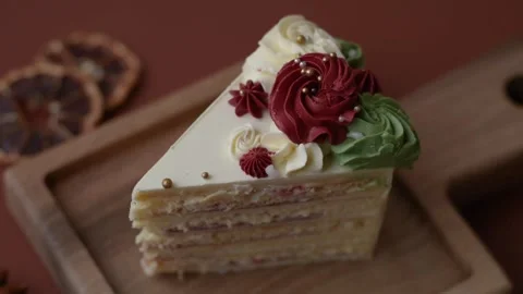 A slice of sweet layered cake with white cream for a birthday or holiday. A slic Stock Footage 324674949