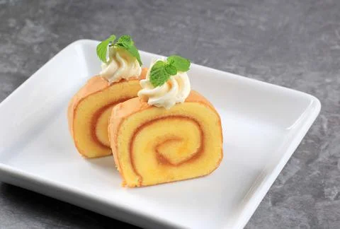 Slice of Swiss Roll with Pineapple Stock Photos