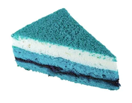 Slice of tasty blue cake with biscuit and cream. Stock Photos
