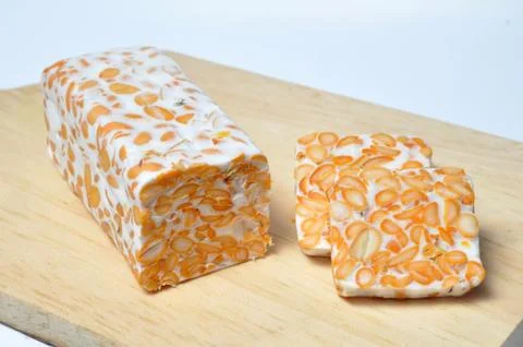 Slice of tempeh on table Stock Photos