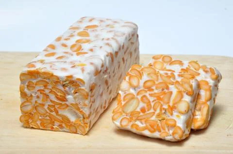 Slice of tempeh on table Stock Photos