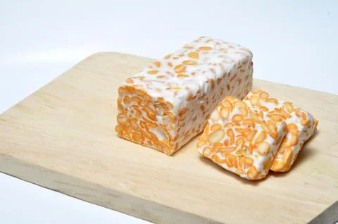 Slice of tempeh on table Stock Photos