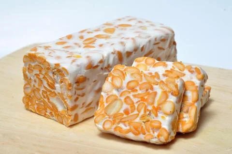 Slice of tempeh on table Stock Photos