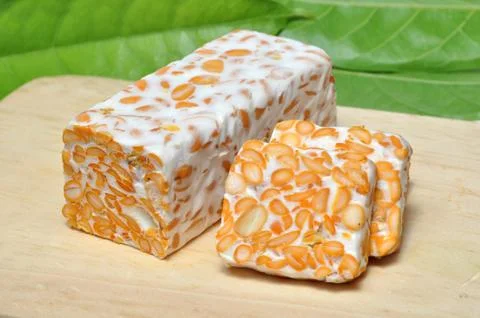 Slice of tempeh on table Stock Photos