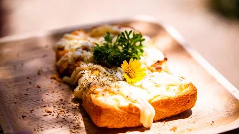 Slice of toasted white bread spread with mayonnaise decorate on top with fl.. Stock Photos