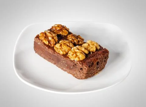 Slice of walnut cake Stock Photos