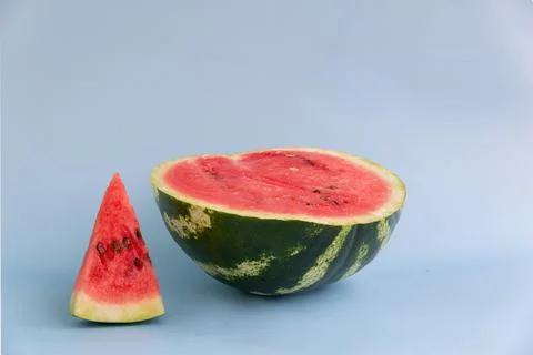 Slice of watermelon isolated on a blue background Stock Photos