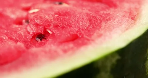 A slice of watermelon. Red pulp of the fruit close-up. Stock Footage 249084413