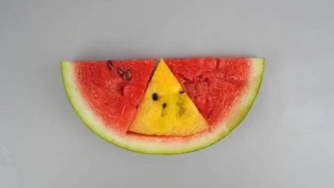 A slice of watermelon in the shape of a red triangle Foto stock