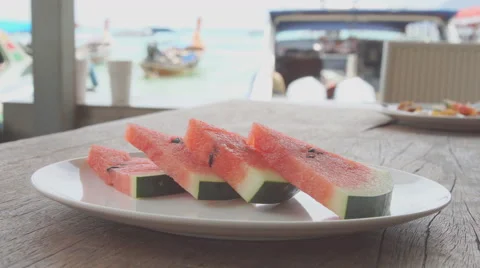 Slice of watermelon on the table on the seafront 動画素材 68735936