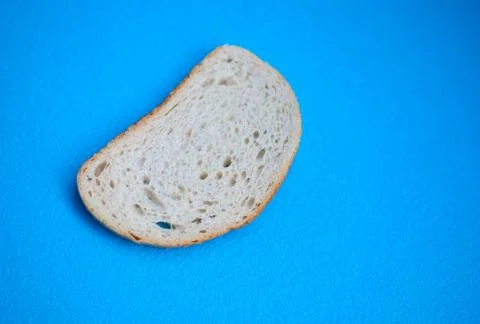 Slice of white wheat bread. Stock Photos